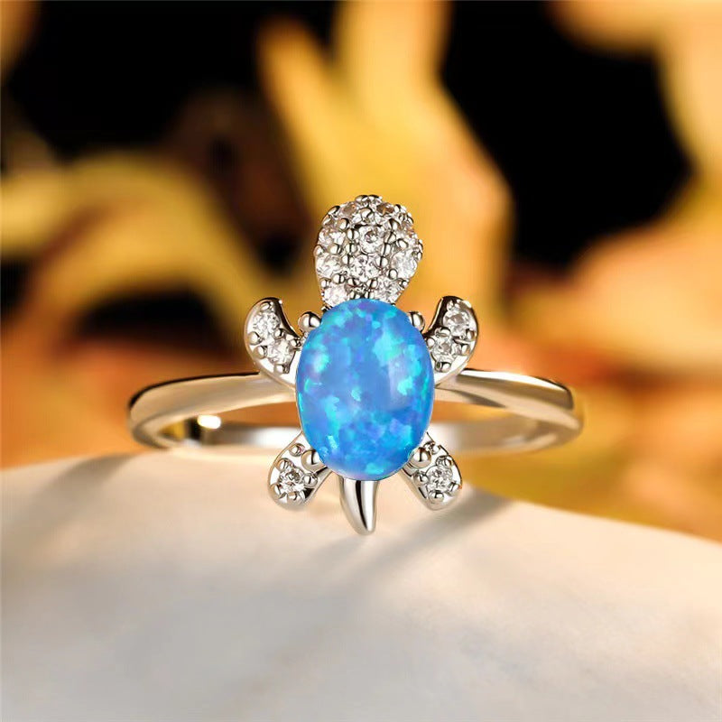 Platinum Ring With A Colored Tortoise Design Featuring Blue Diamondsunisex